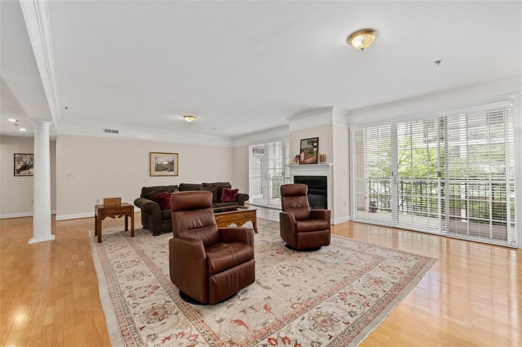 3101 Howell Mill Road Northwest, Unit 227 Atlanta, GA 30327 - Photo 6 of 48 a living room with furniture and a rug