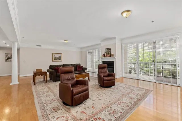 a living room with furniture and a rug