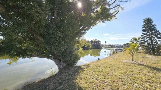 a view of a house with backyard and sitting area