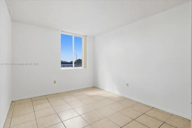 a bedroom with bed and walk in closet