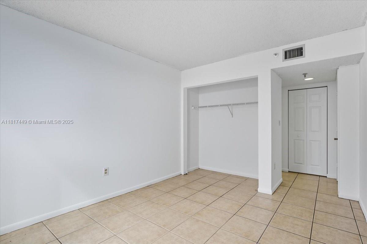 616 Northwest 26th Avenue, Unit 210 Miami, FL 33125 - Photo 13 of 23 a view of an empty room
