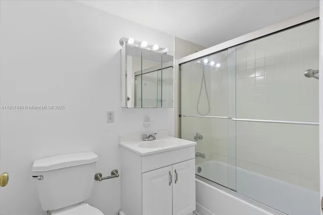 a bathroom with a sink toilet and vanity
