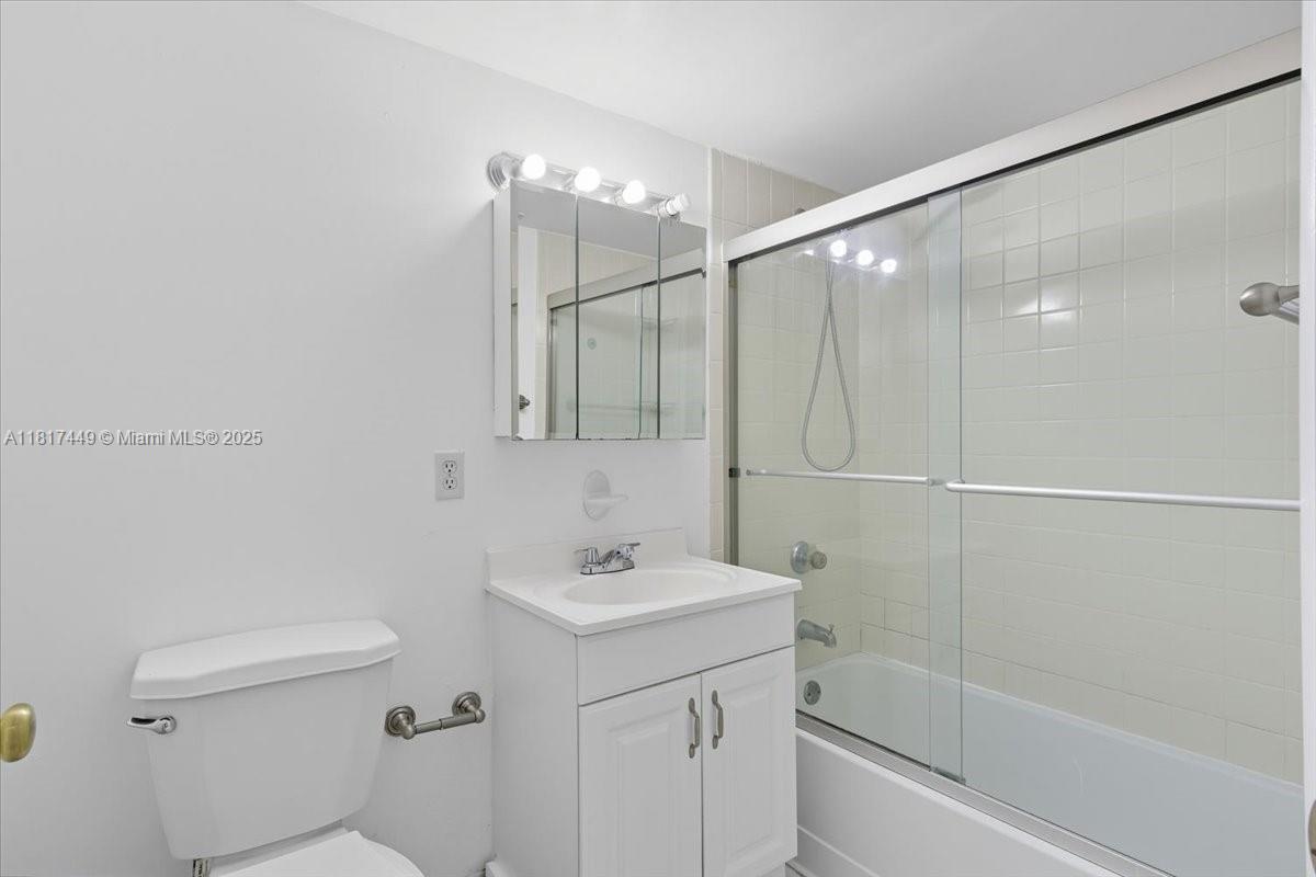 616 Northwest 26th Avenue, Unit 210 Miami, FL 33125 - Photo 15 of 23 a bathroom with a sink a toilet and shower