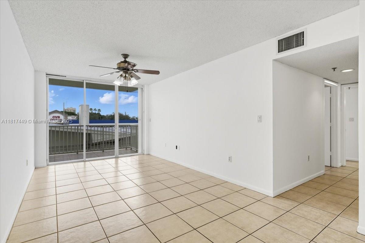 616 Northwest 26th Avenue, Unit 210 Miami, FL 33125 - Photo 3 of 23 a view of a livingroom with a furniture and chandelier