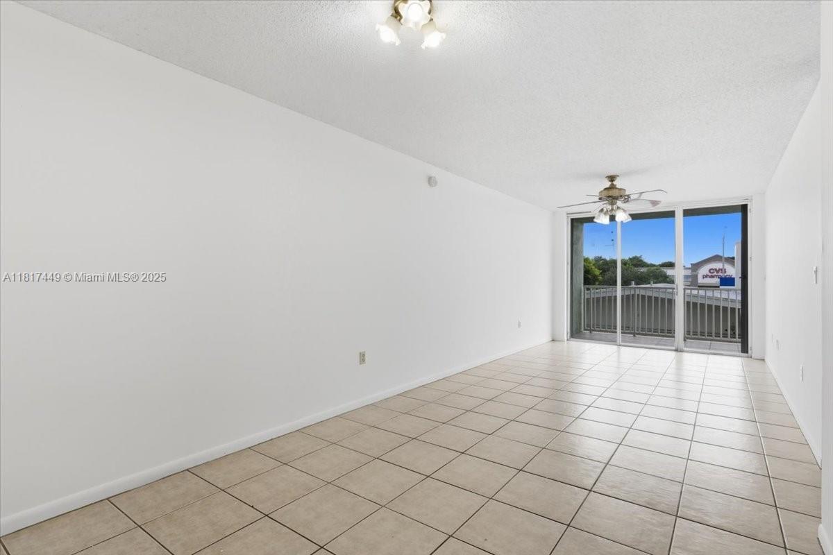 616 Northwest 26th Avenue, Unit 210 Miami, FL 33125 - Photo 4 of 23 a view of a livingroom with a furniture and window
