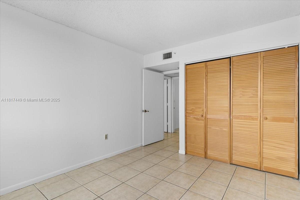 616 Northwest 26th Avenue, Unit 210 Miami, FL 33125 - Photo 9 of 23 a view of a room with an empty room