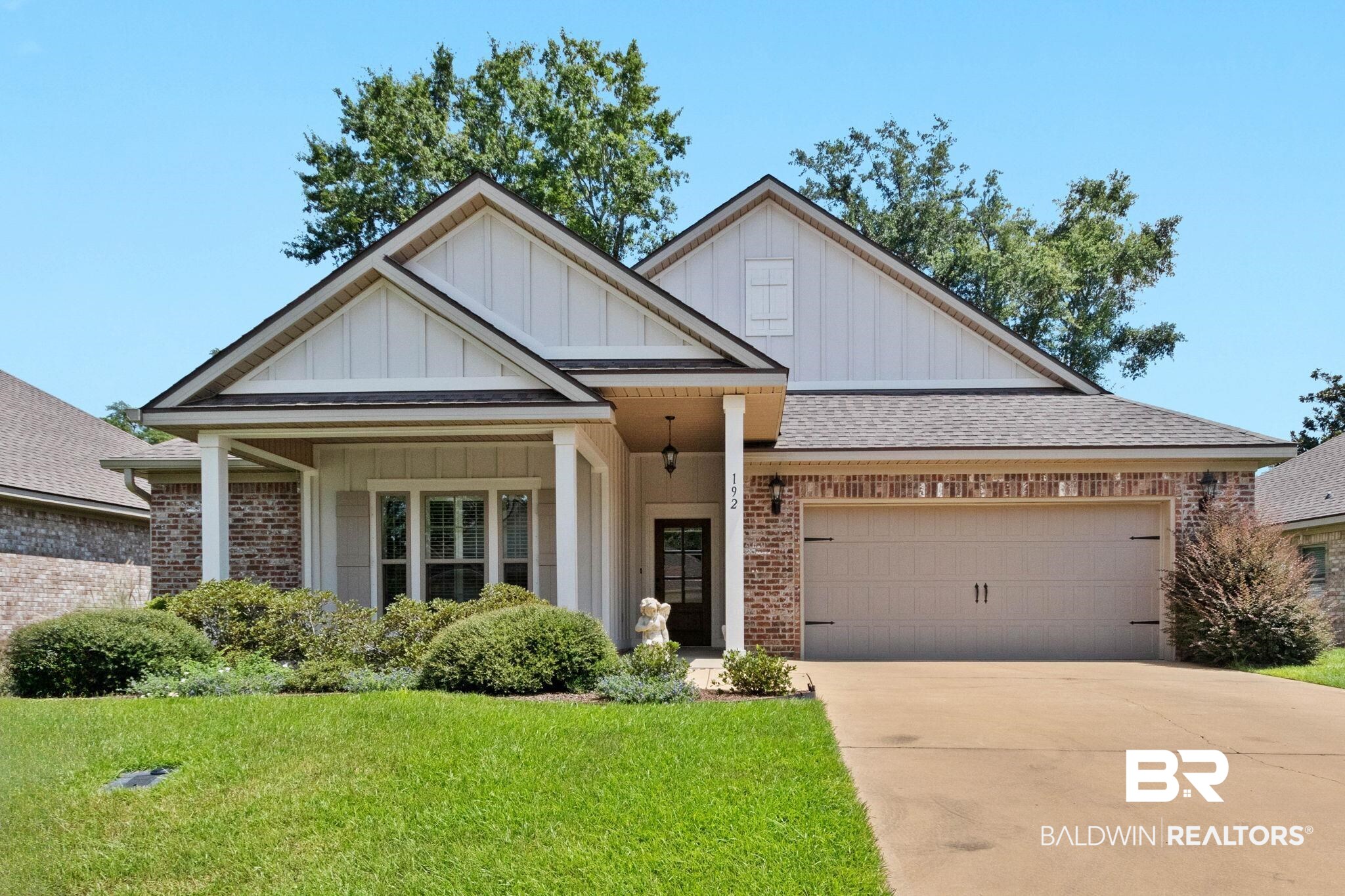192 Mark Twain Loop Foley, AL 36535 - Photo 1 of 42 View of front of property featuring a garage and a front yard