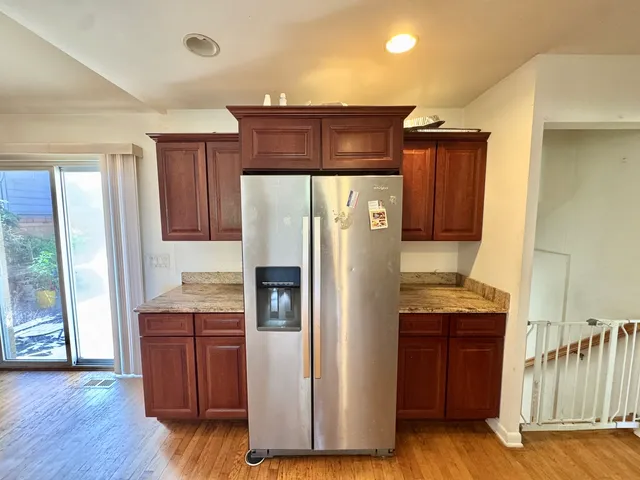 a kitchen with stainless steel appliances a refrigerator and a stove
