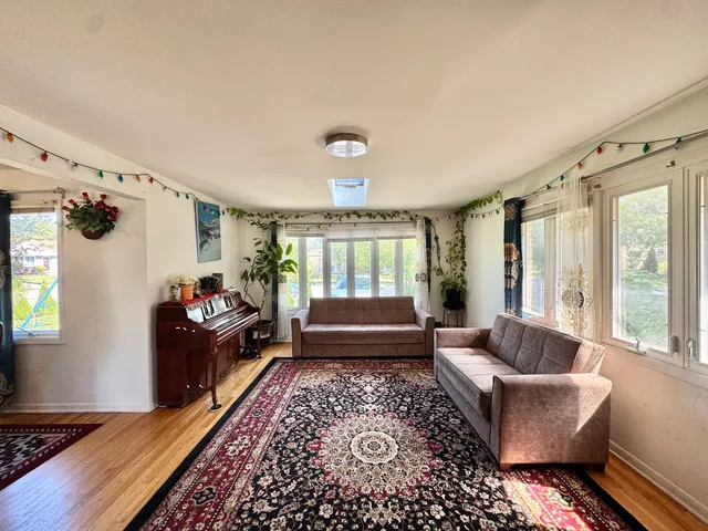 a living room with furniture and a rug