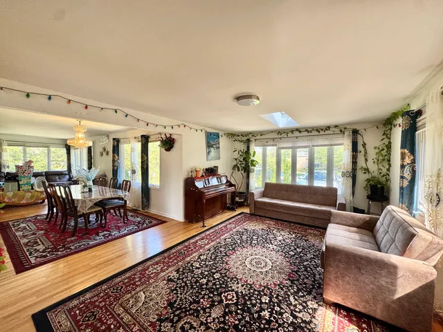 a living room with furniture rug and window