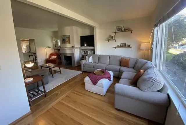a living room with furniture fireplace and a flat screen tv