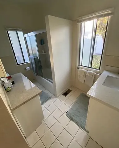 a bathroom with a sink and mirror
