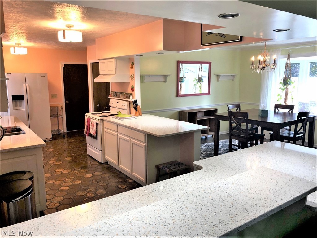 1951 Devonshire Road Northwest Canton, OH 44708 - Photo 14 of 35 New quartz counter tops (2014) kitchen and dining room. Several extra seating spaces at the counter