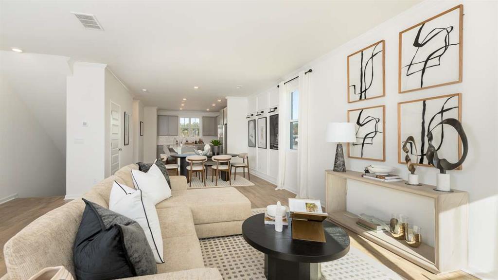 717 Alburgh Alley Mableton, GA 30126 - Photo 12 of 38 a living room with furniture and a table