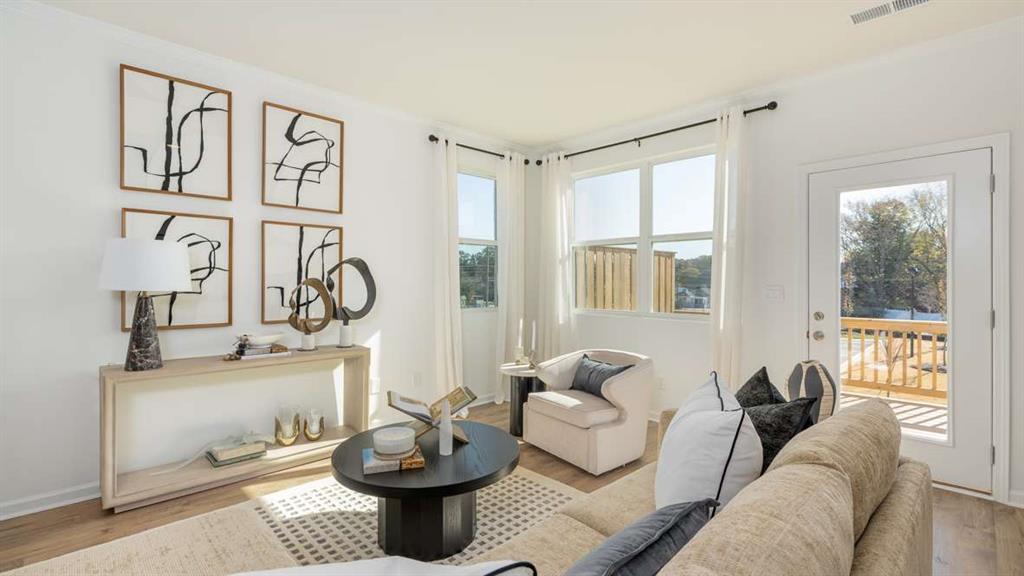 717 Alburgh Alley Mableton, GA 30126 - Photo 13 of 38 a living room with furniture and a large window