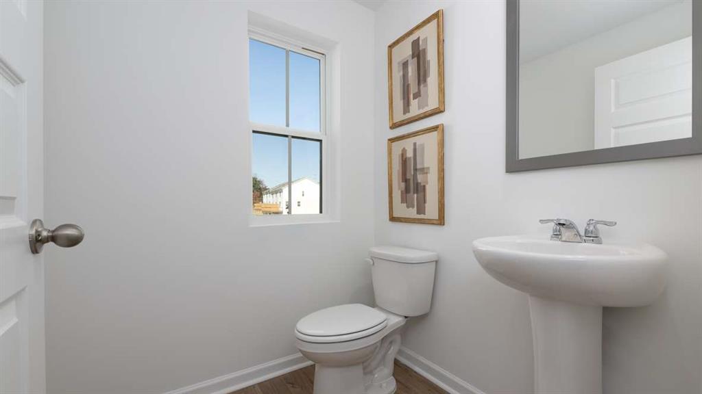 717 Alburgh Alley Mableton, GA 30126 - Photo 23 of 38 a bathroom with a toilet sink and mirror