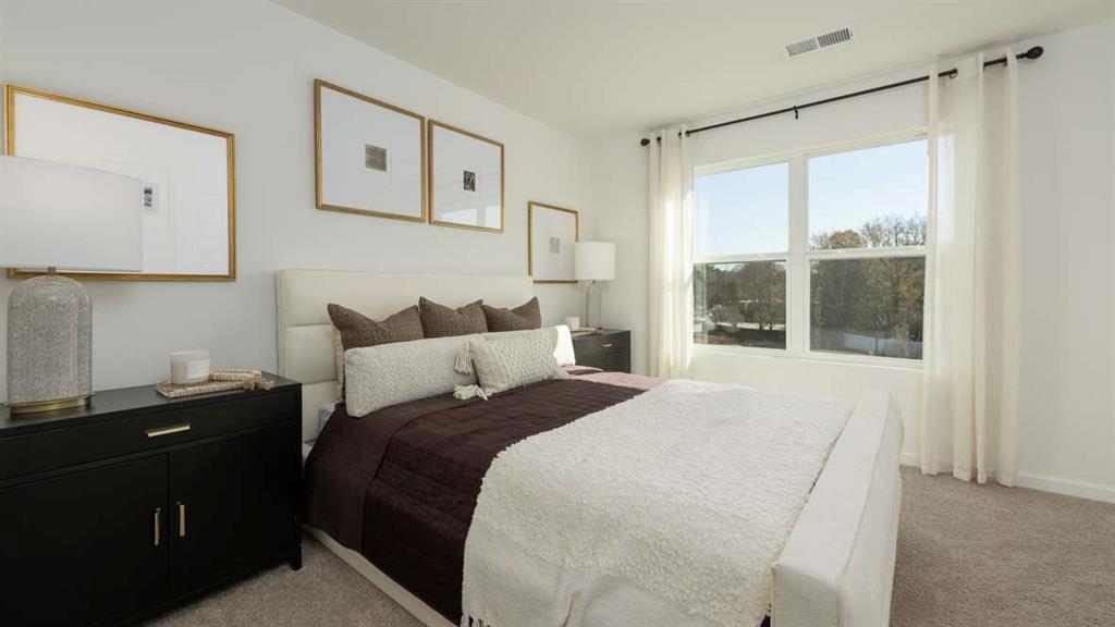 717 Alburgh Alley Mableton, GA 30126 - Photo 24 of 38 a bedroom with a bed and a window