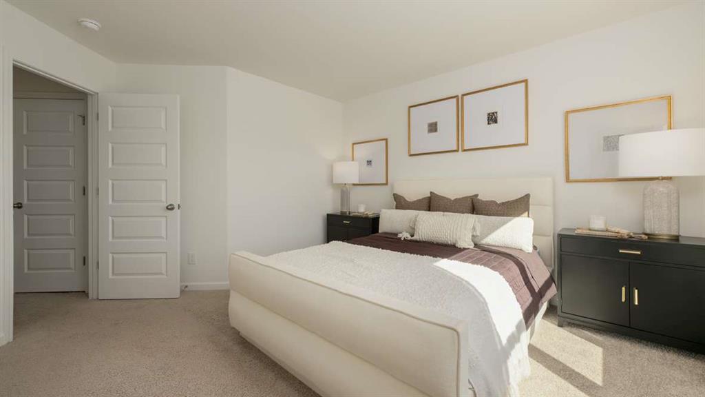 717 Alburgh Alley Mableton, GA 30126 - Photo 27 of 38 a bedroom with a bed and lamp