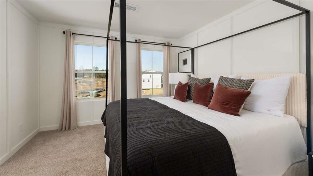 717 Alburgh Alley Mableton, GA 30126 - Photo 33 of 38 a bedroom with a balcony a bed and a walk in closet