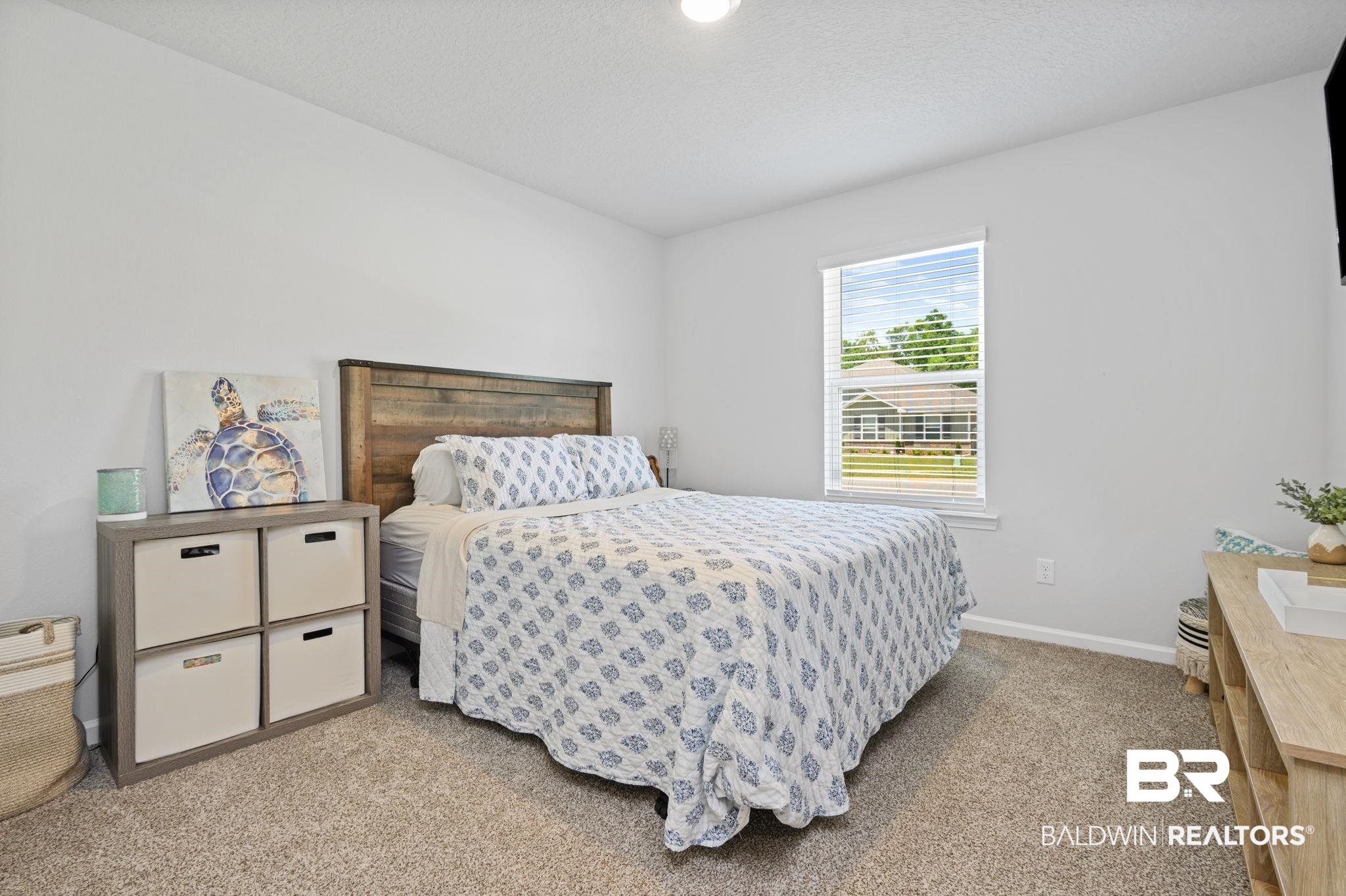 8021 Valor Rdg Way North Mobile, AL 36619 - Photo 17 of 34 Carpeted bedroom featuring a window with horizontal blinds, providing natural illumination