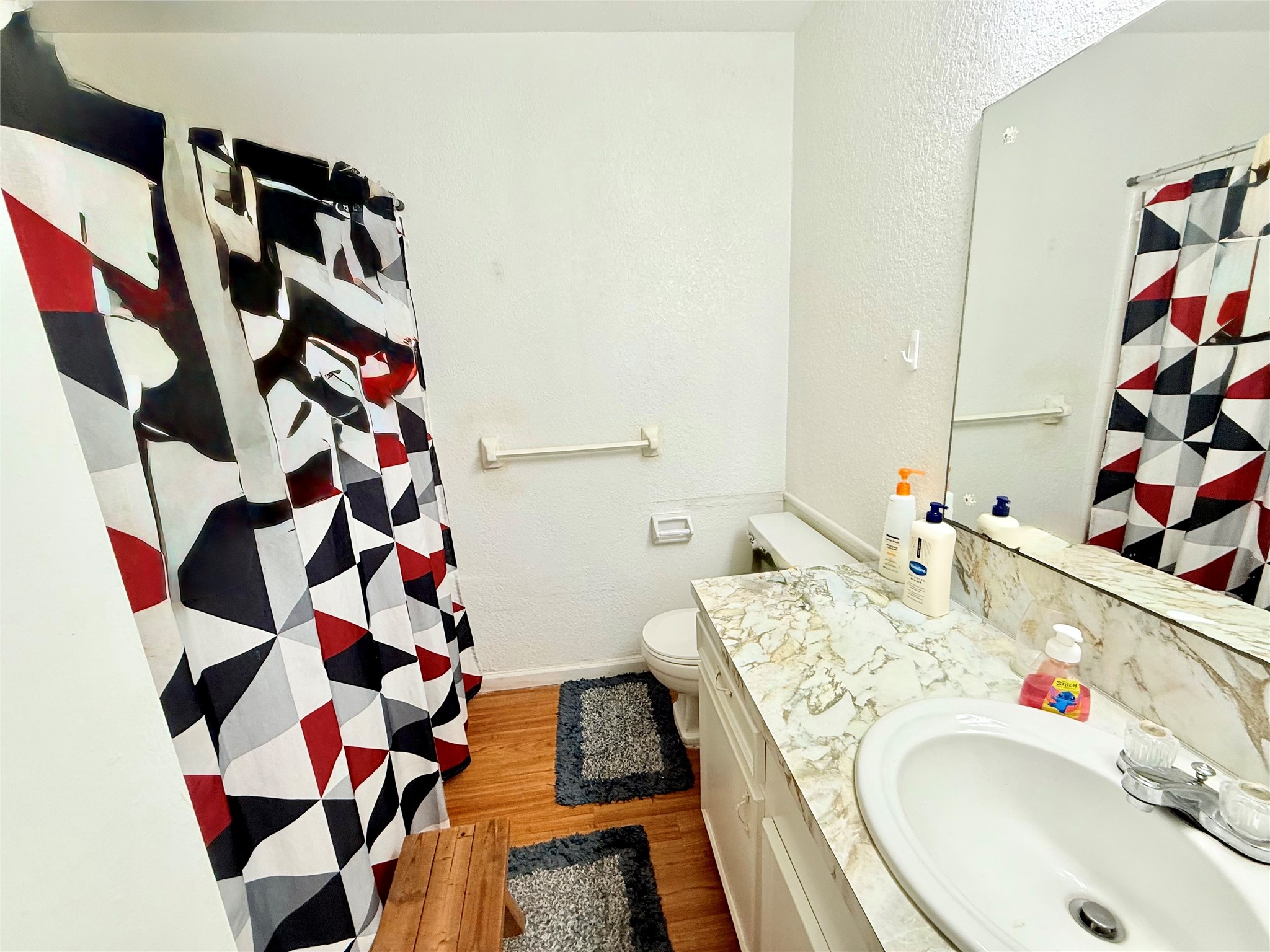 2112 Rose Road Pearland, TX 77581 - Photo 12 of 15 a bathroom with a sink and a bathtub