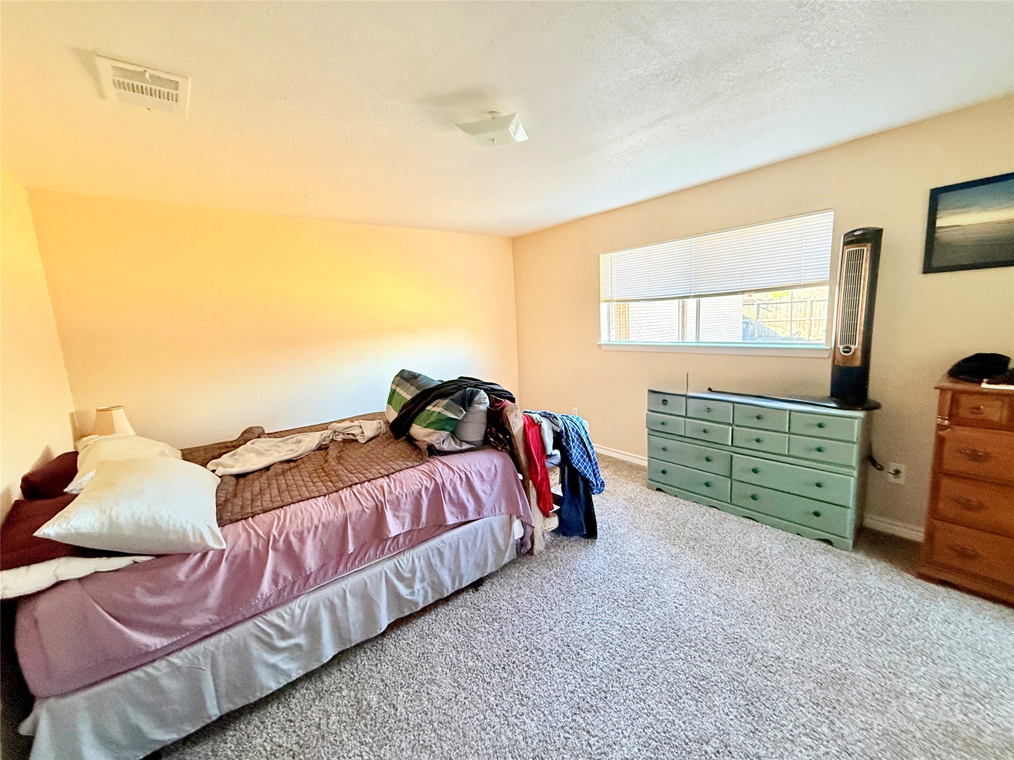 2112 Rose Road Pearland, TX 77581 - Photo 8 of 15 a bed room with a bed and a chair