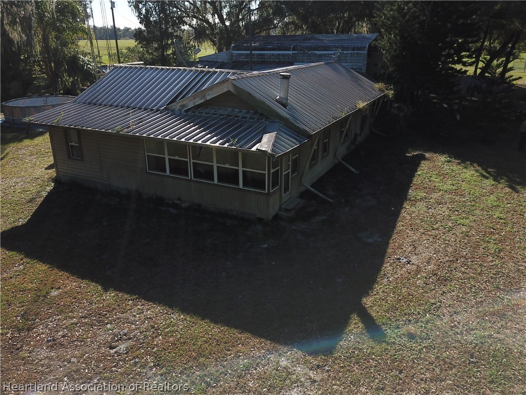 6211 Van Simmons Road Wauchula, FL 33873 - Photo 4 of 8 a backyard of a house with lots of green space