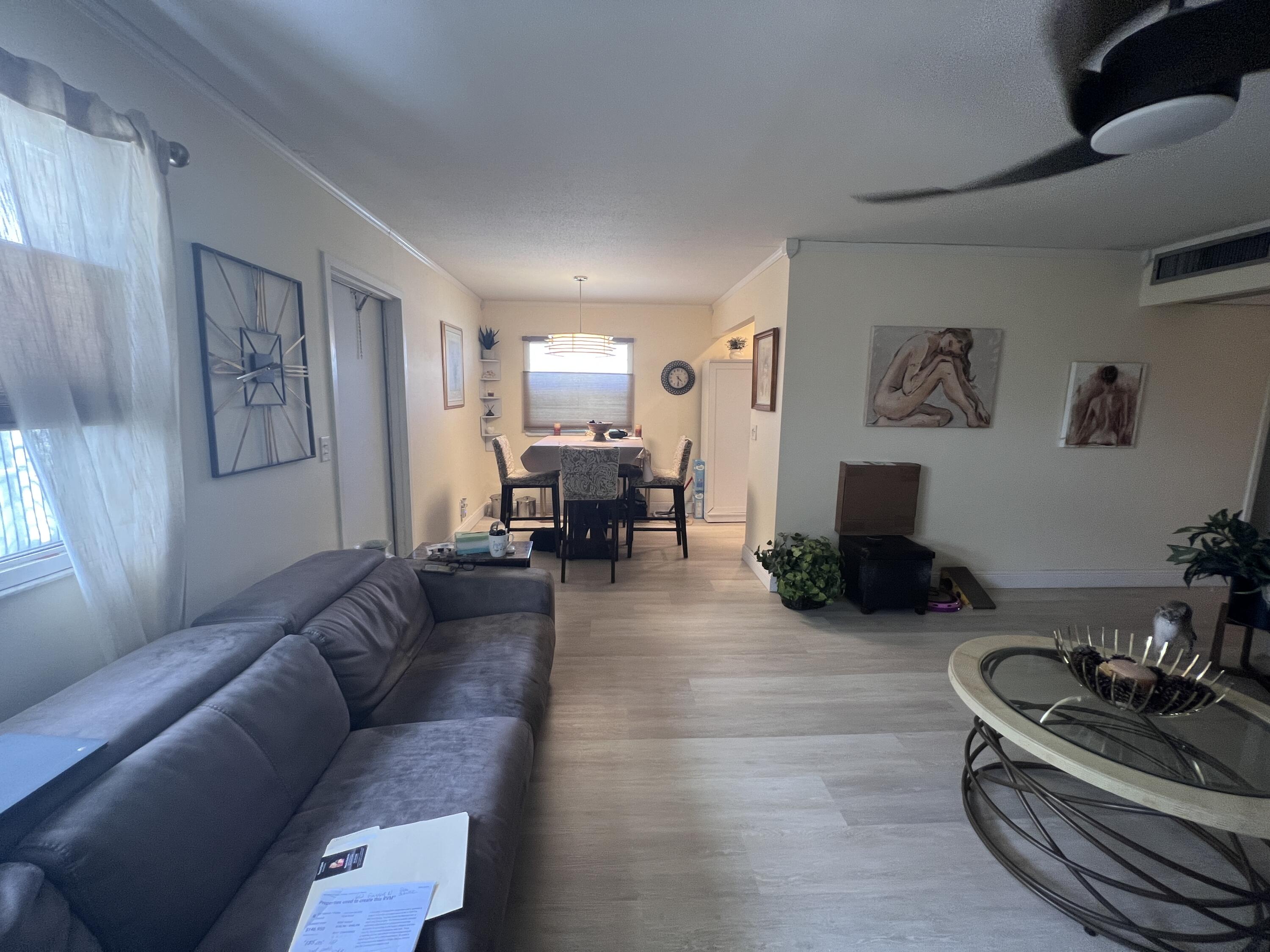 652 Flanders North Delray Beach, FL 33484 - Photo 12 of 27 a living room with furniture or couch and a kitchen