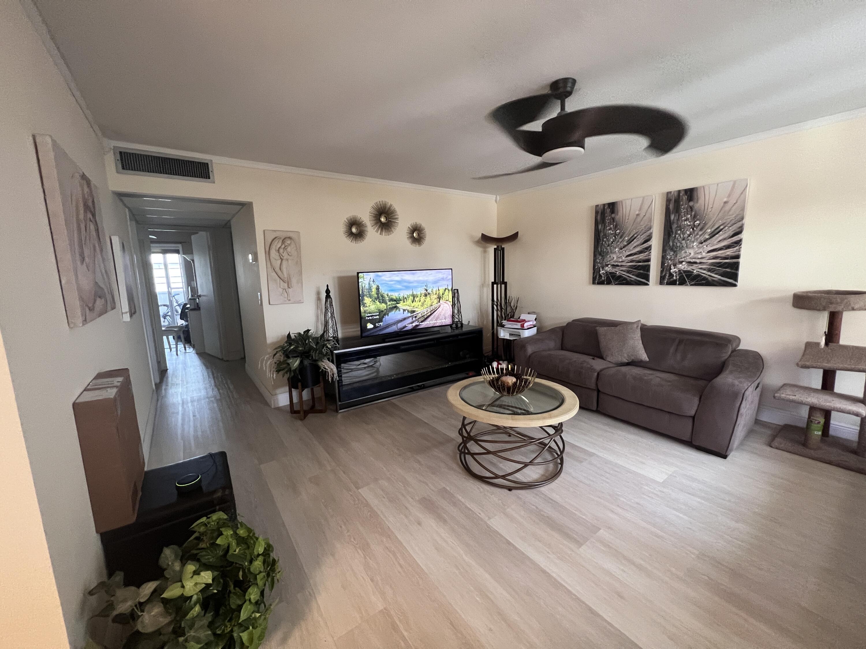 652 Flanders North Delray Beach, FL 33484 - Photo 15 of 27 a living room with furniture and a flat screen tv