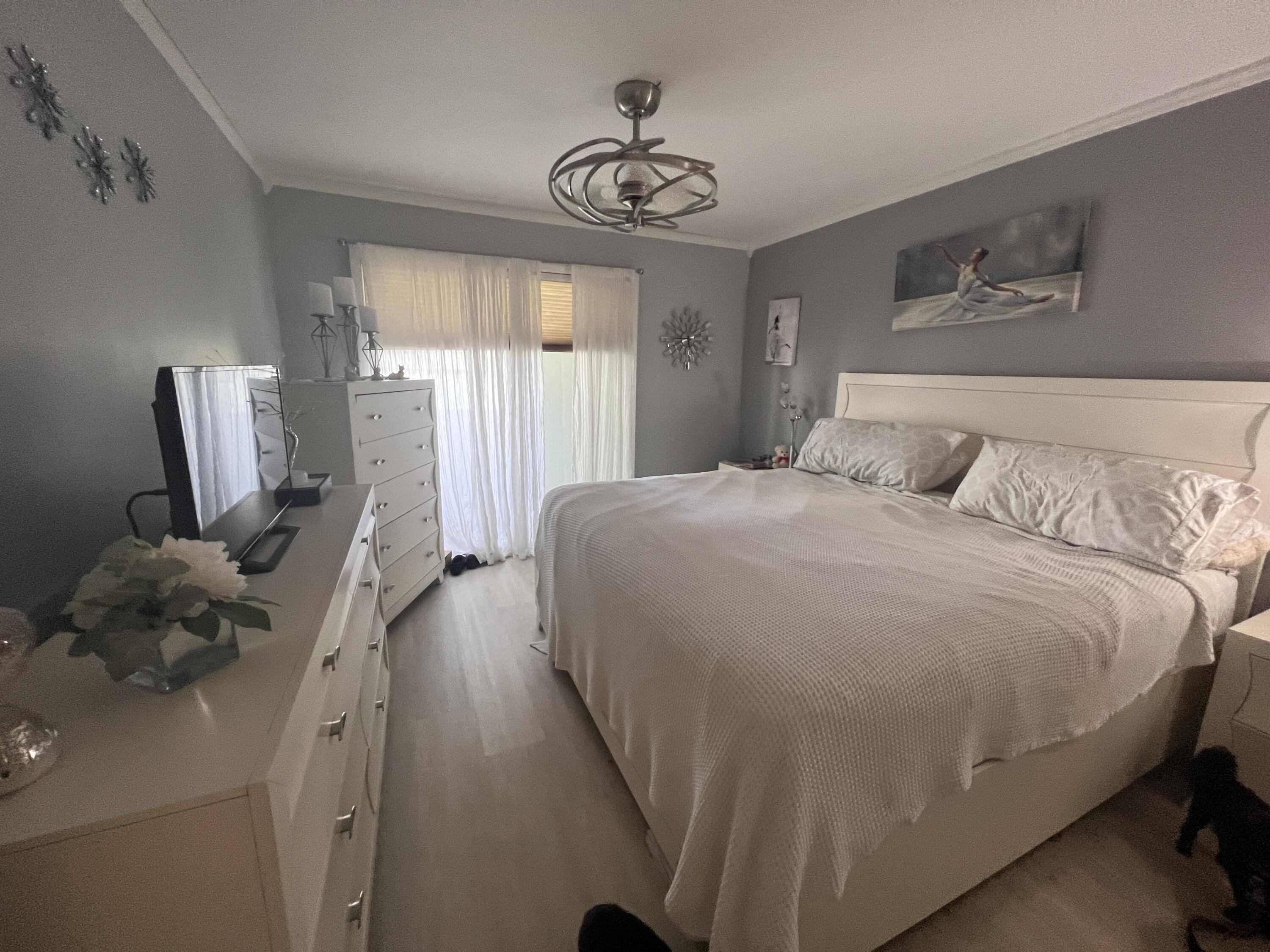 652 Flanders North Delray Beach, FL 33484 - Photo 16 of 27 a bedroom with a bed and window