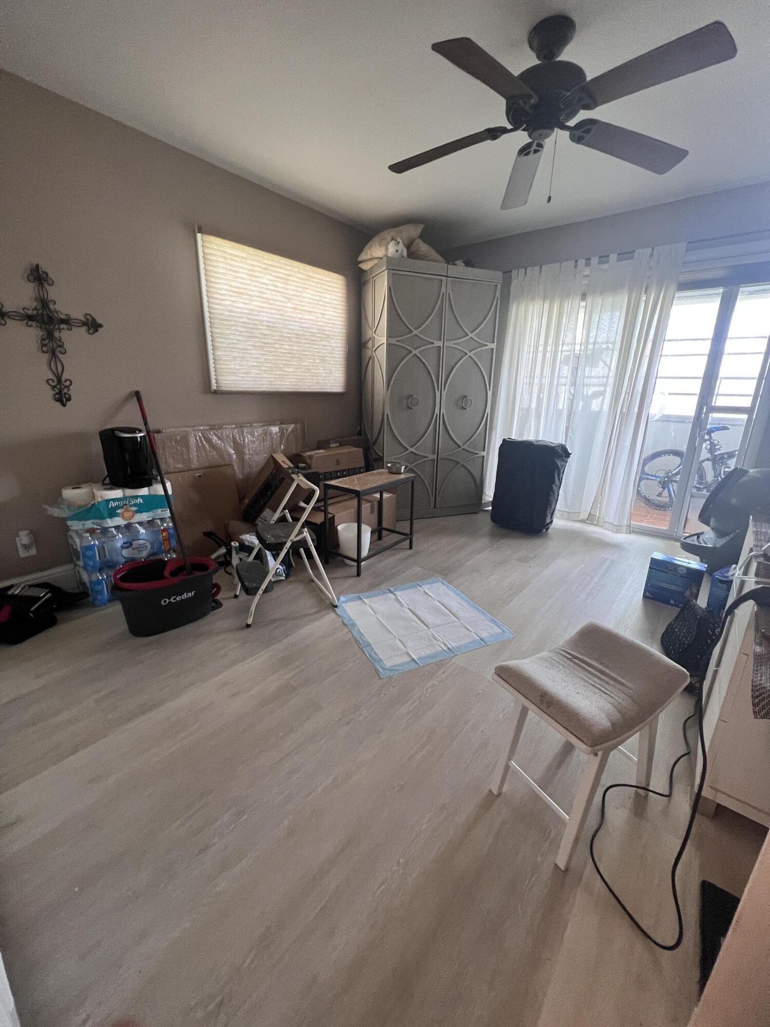 652 Flanders North Delray Beach, FL 33484 - Photo 21 of 27 a living room with furniture a flat screen tv and a window