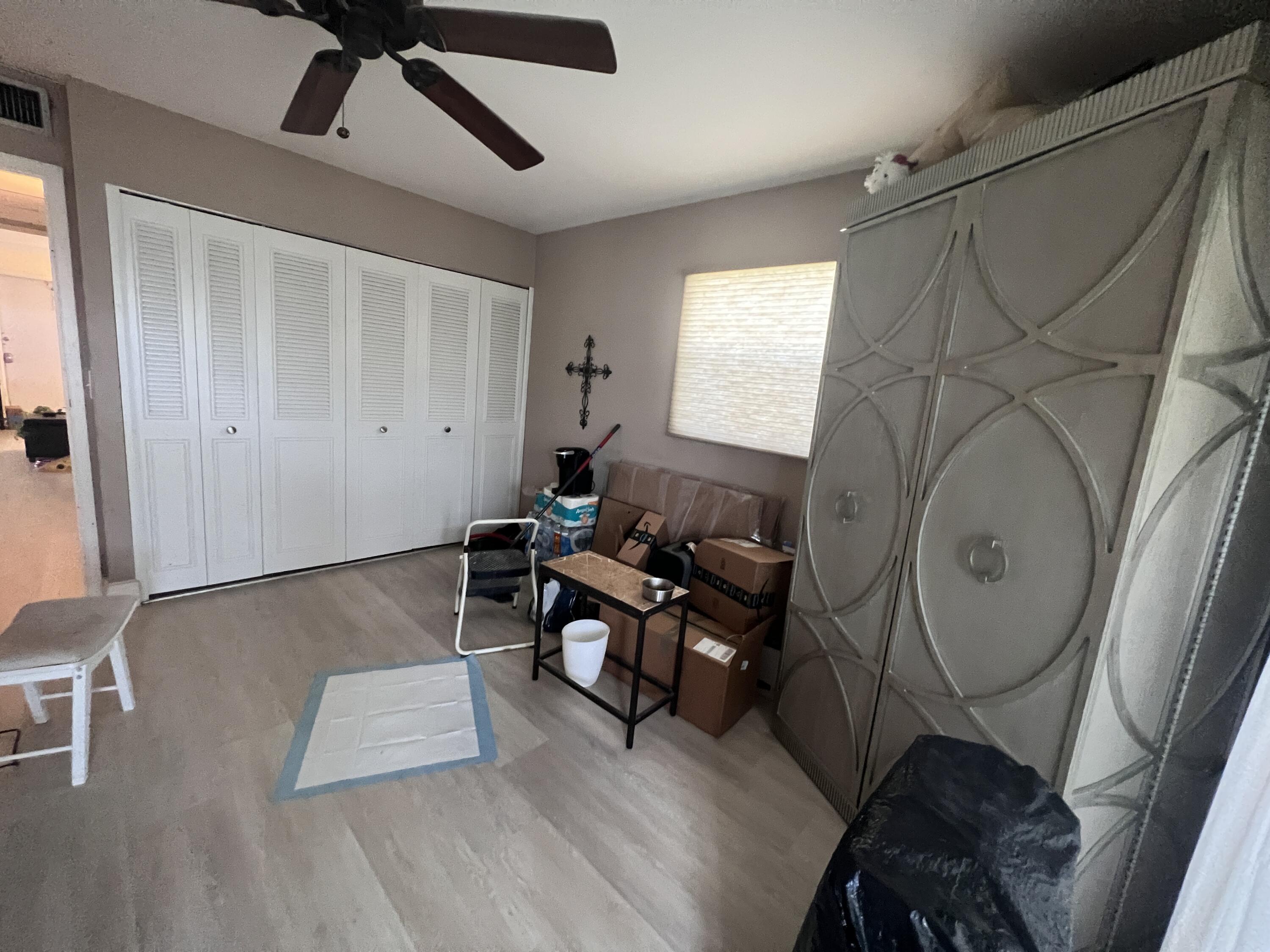 652 Flanders North Delray Beach, FL 33484 - Photo 22 of 27 a living room with furniture and a window