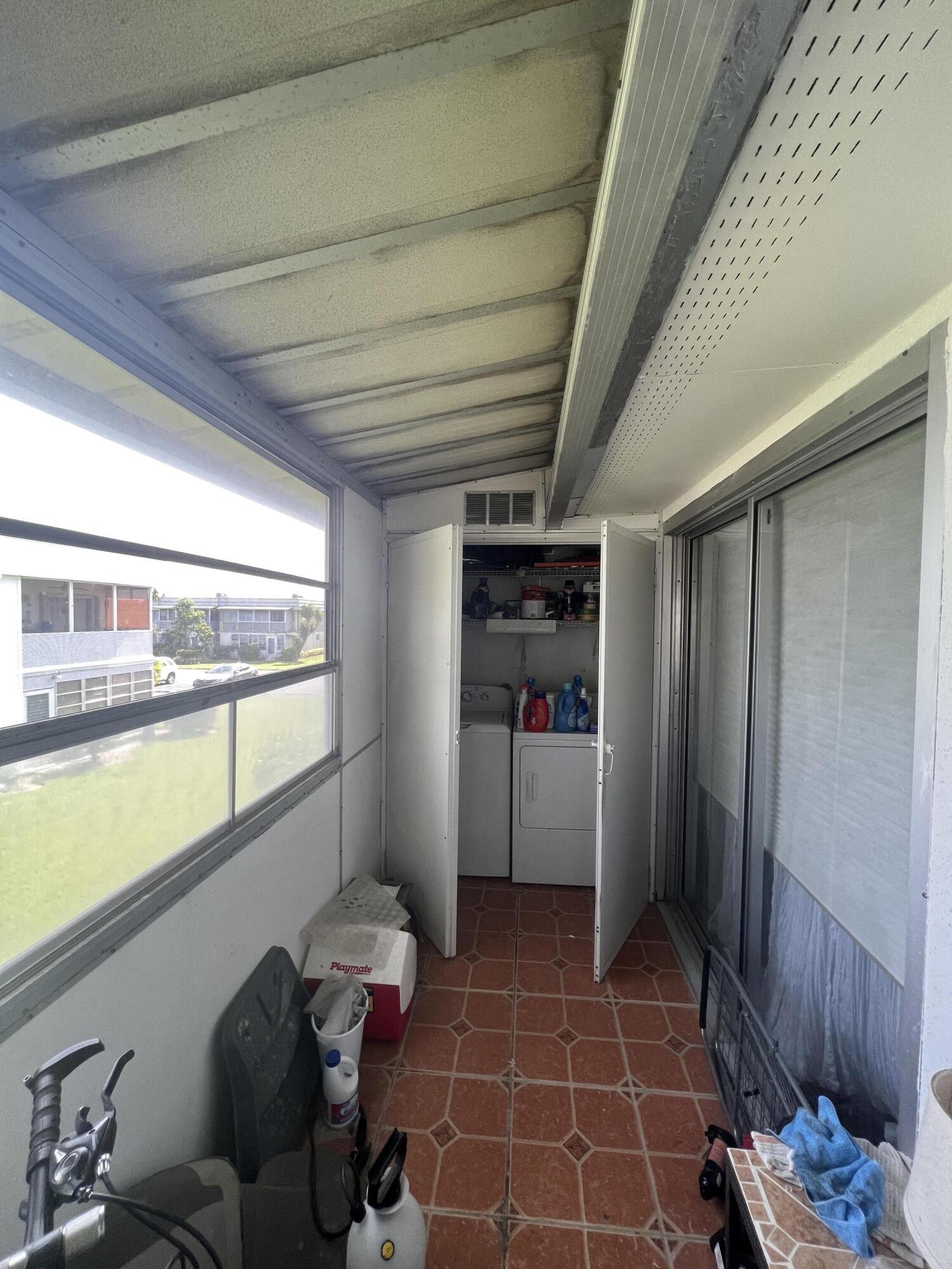 652 Flanders North Delray Beach, FL 33484 - Photo 26 of 27 a room with storage and utility