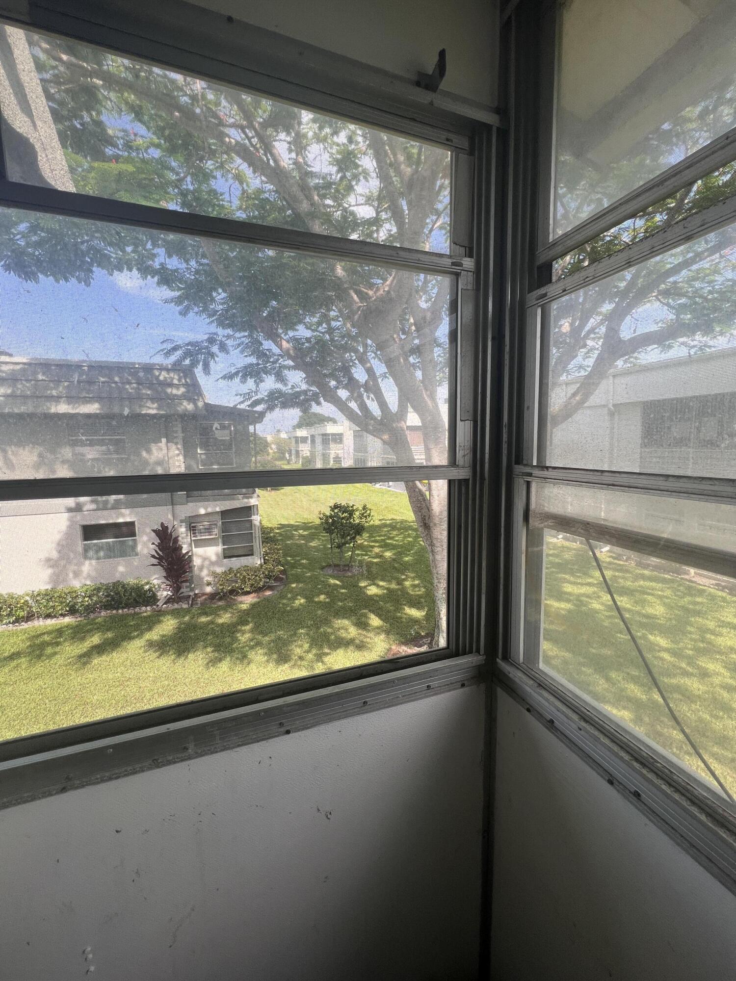 652 Flanders North Delray Beach, FL 33484 - Photo 27 of 27 a view of swimming pool from a window
