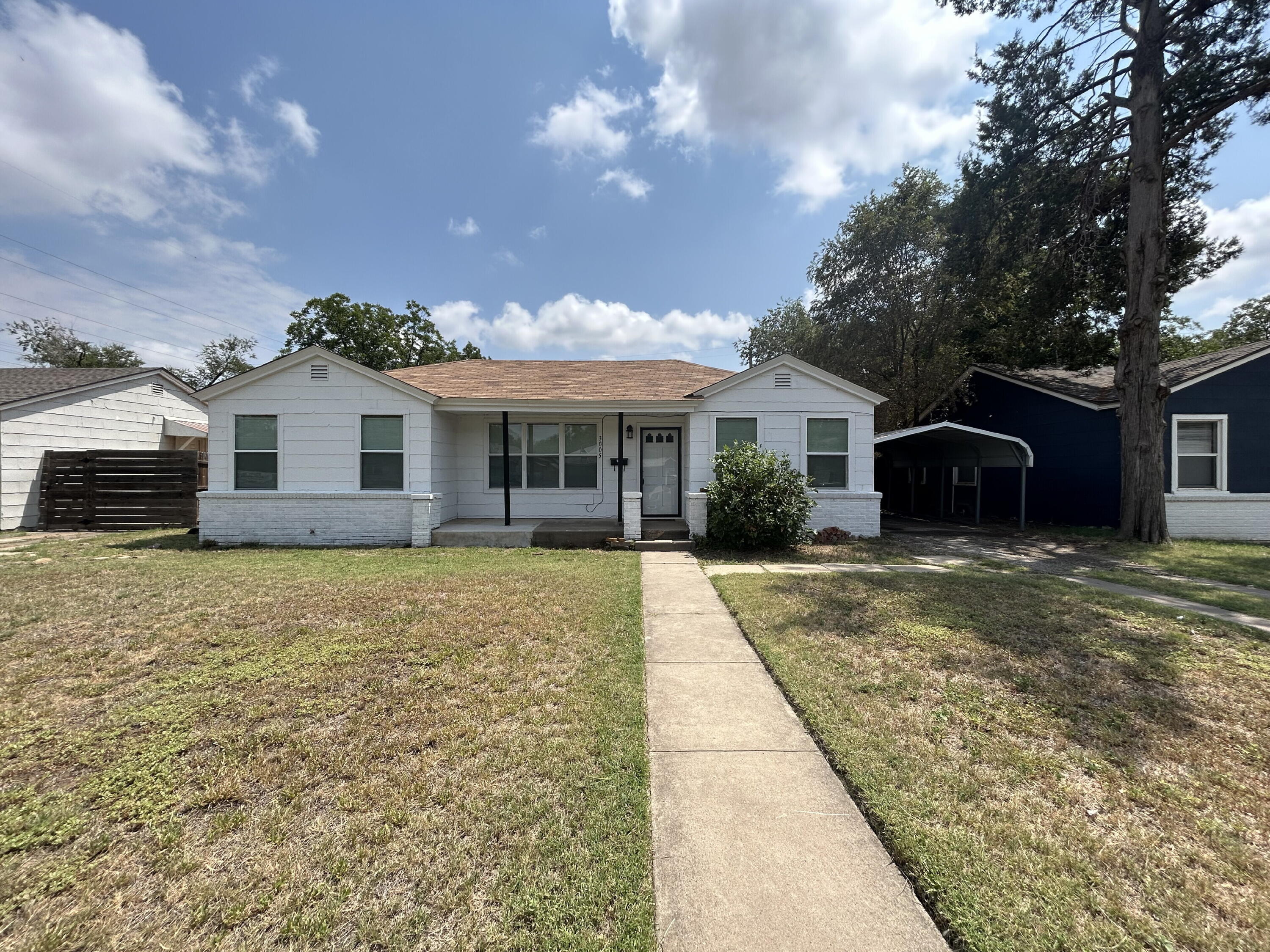 3005 31st Street Lubbock, TX 79410 - Photo 1 of 11 a view of a house with a backyard