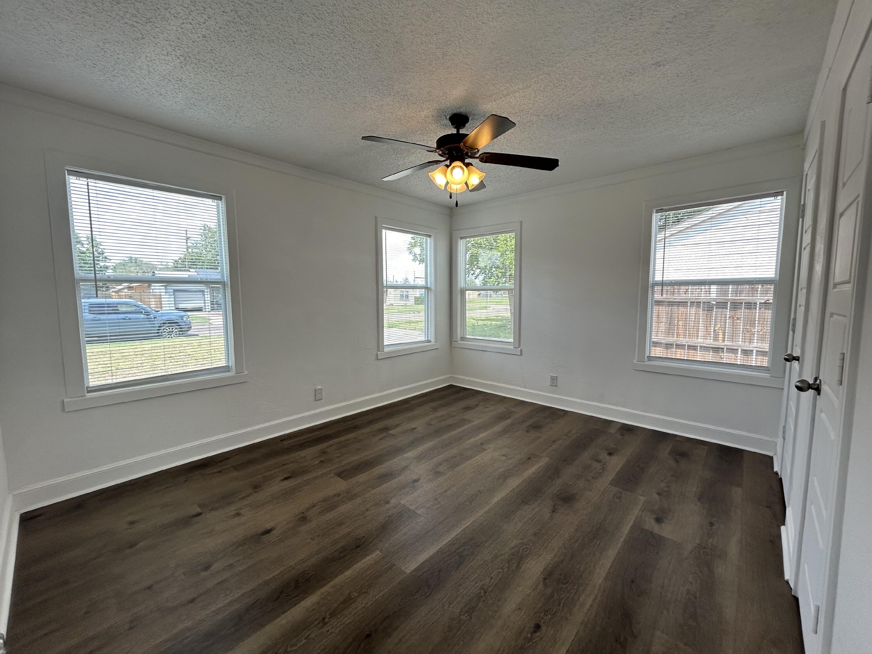 3005 31st Street Lubbock, TX 79410 - Photo 8 of 11 a view of an empty room with a window