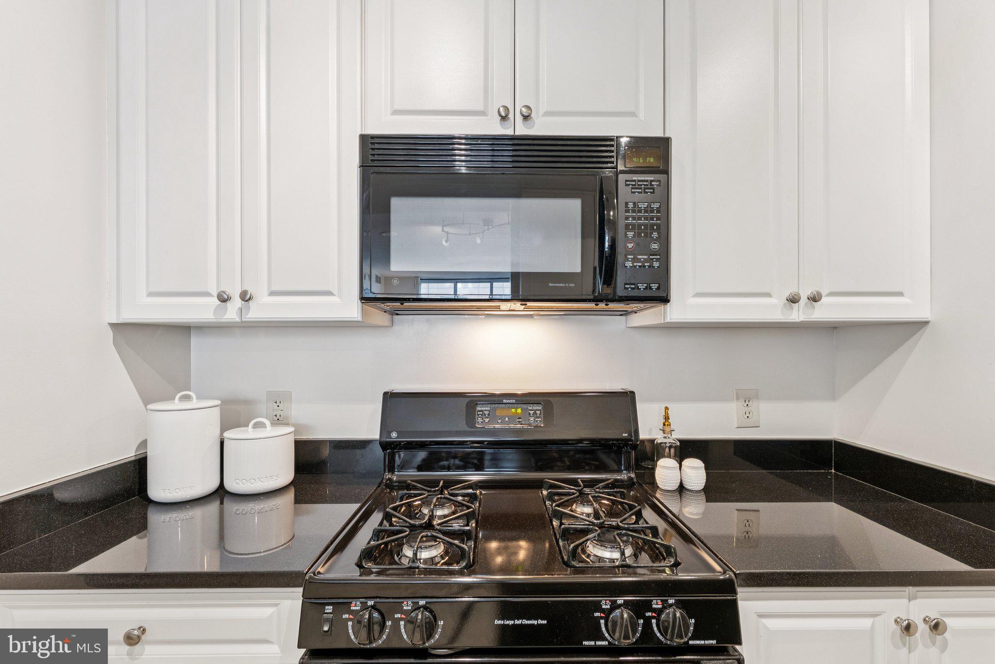 851 North Glebe Road, Unit 718 Arlington, VA 22203 - Photo 12 of 37 a stove top oven sitting inside of a kitchen