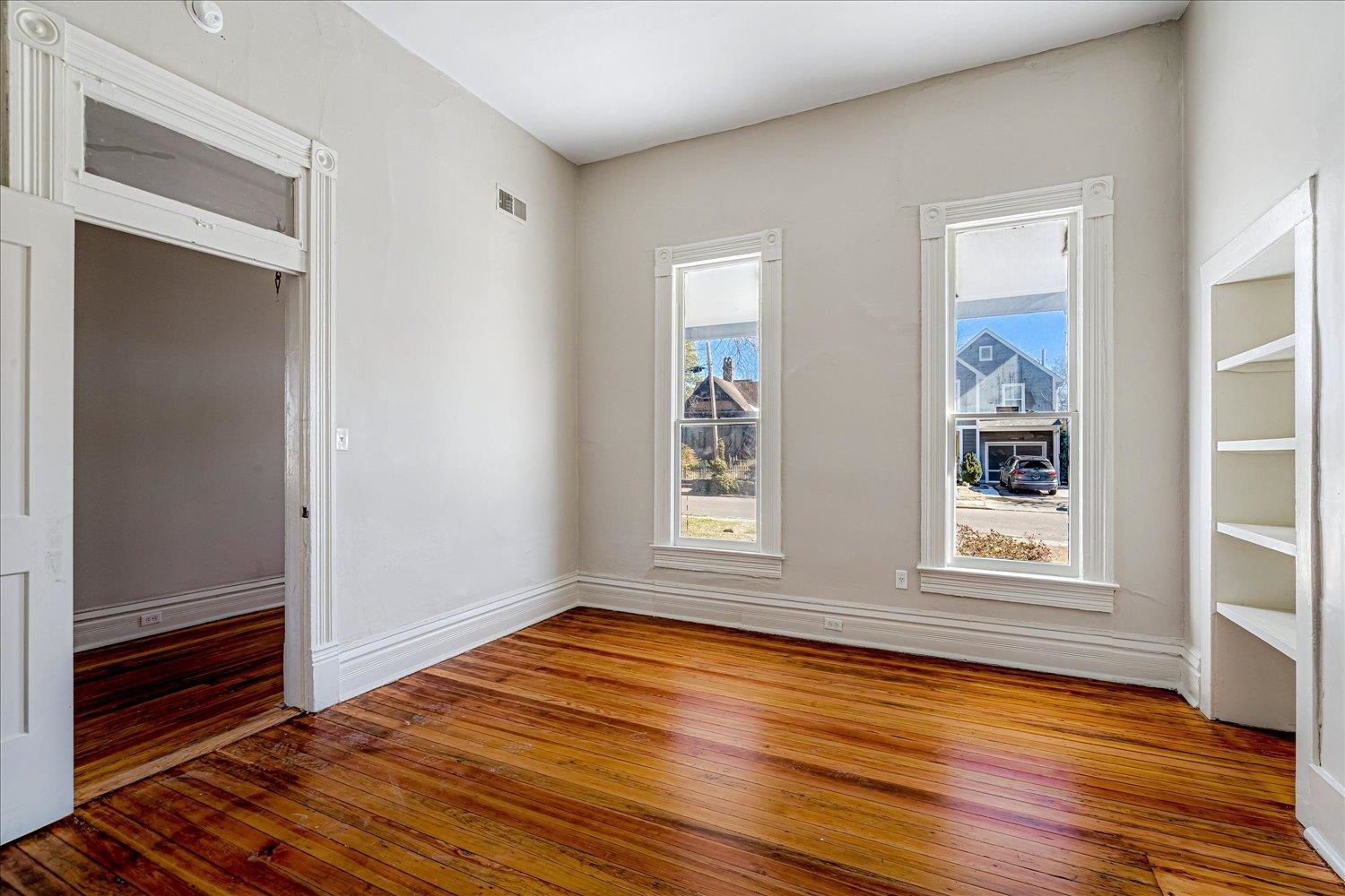 1069 Blythe Street Memphis, TN 38104 - Photo 14 of 24 Unfurnished room featuring hardwood / wood-style floors