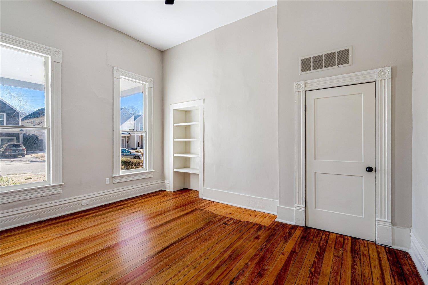 1069 Blythe Street Memphis, TN 38104 - Photo 15 of 24 Spare room featuring wood-type flooring and built in shelves