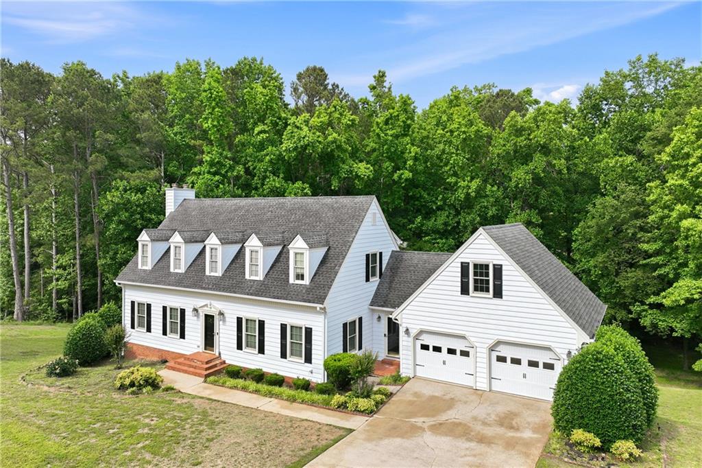 3608 Maple Forge Lane Gainesville, GA 30504 - Photo 37 of 45 a view of a white house with a yard and potted plants