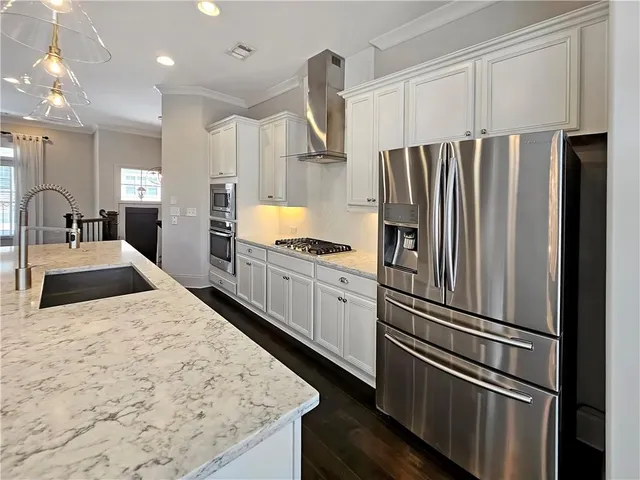 a kitchen with appliances and cabinets