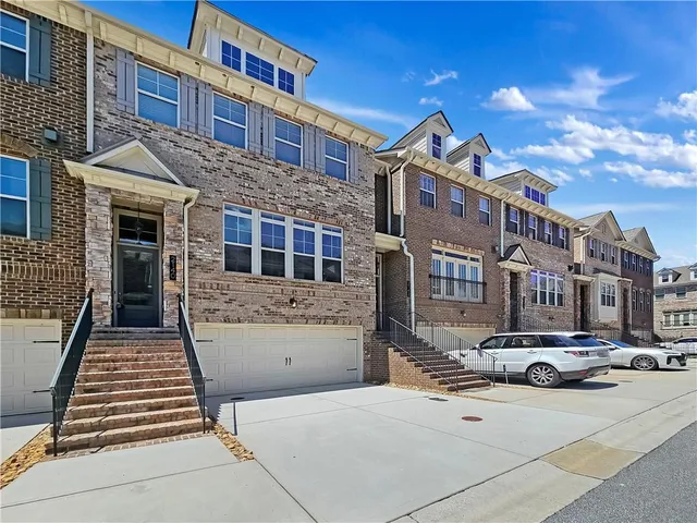 a front view of a building with many windows