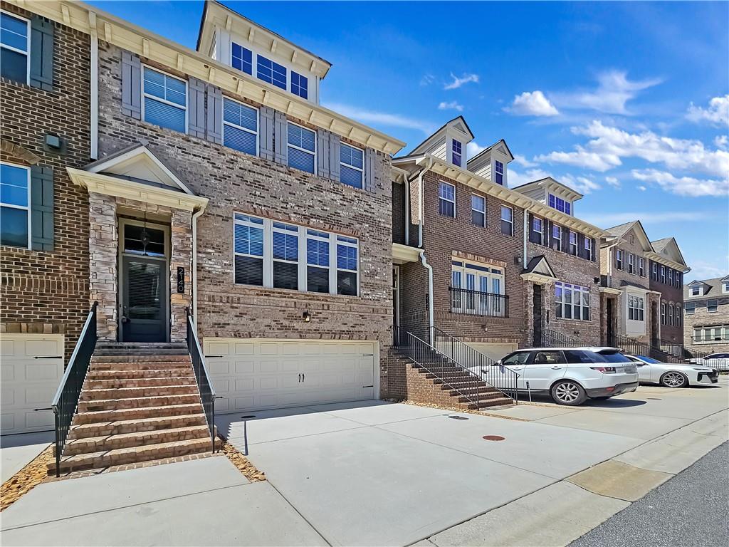 2142 Coventry Drive Brookhaven, GA 30319 - Photo 2 of 52 a front view of a building with many windows