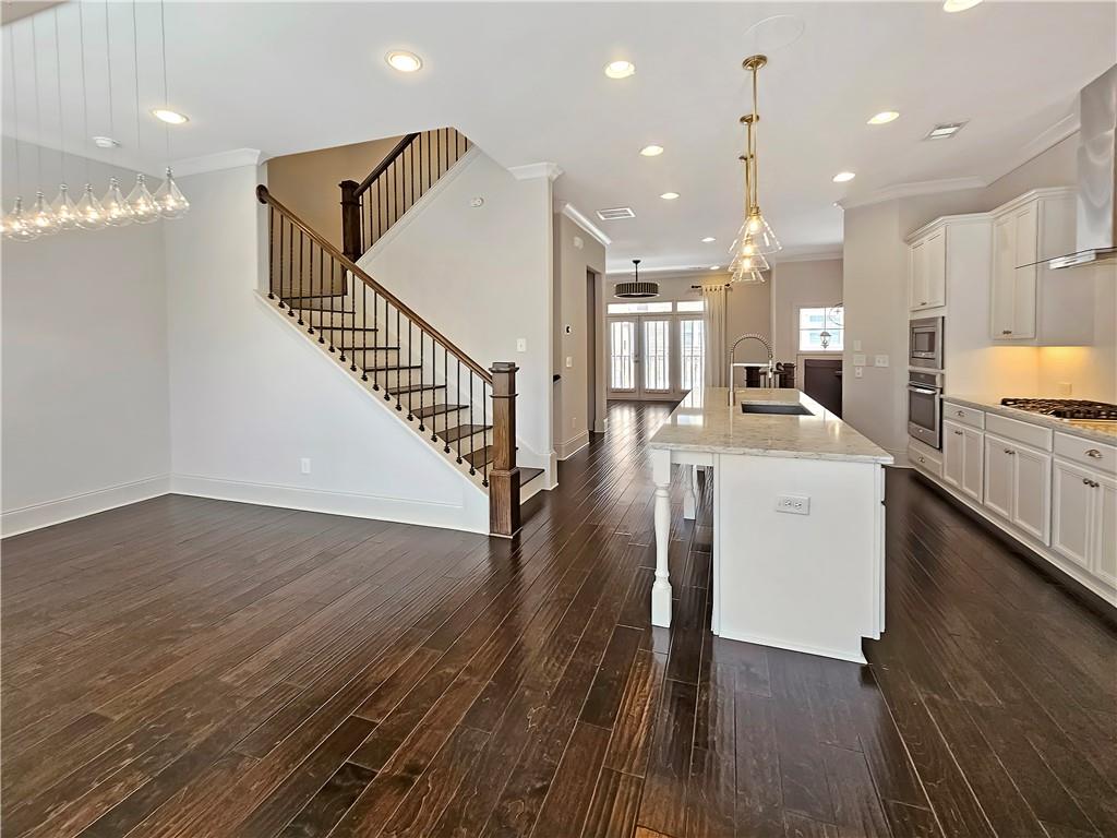 2142 Coventry Drive Brookhaven, GA 30319 - Photo 22 of 52 a open kitchen with white cabinets and stainless steel appliances
