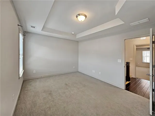 a bathroom with a sink a toilet a mirror and shower