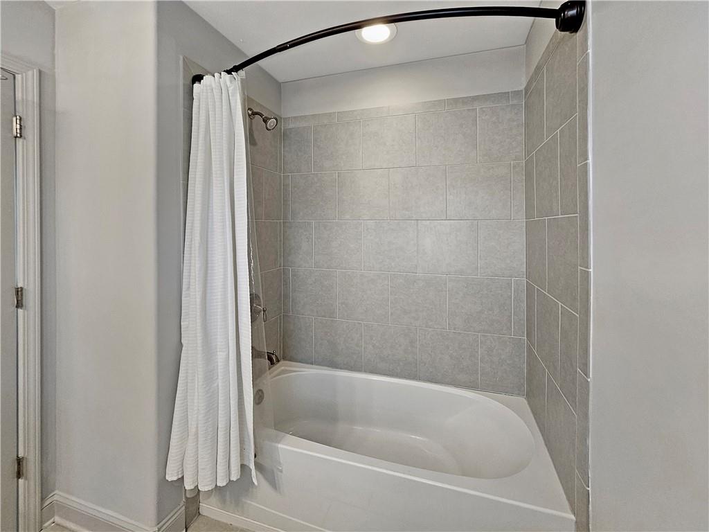 2142 Coventry Drive Brookhaven, GA 30319 - Photo 30 of 52 a bathroom with a shower and a bath tub