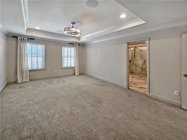a bathroom with a granite countertop sink mirror and shower