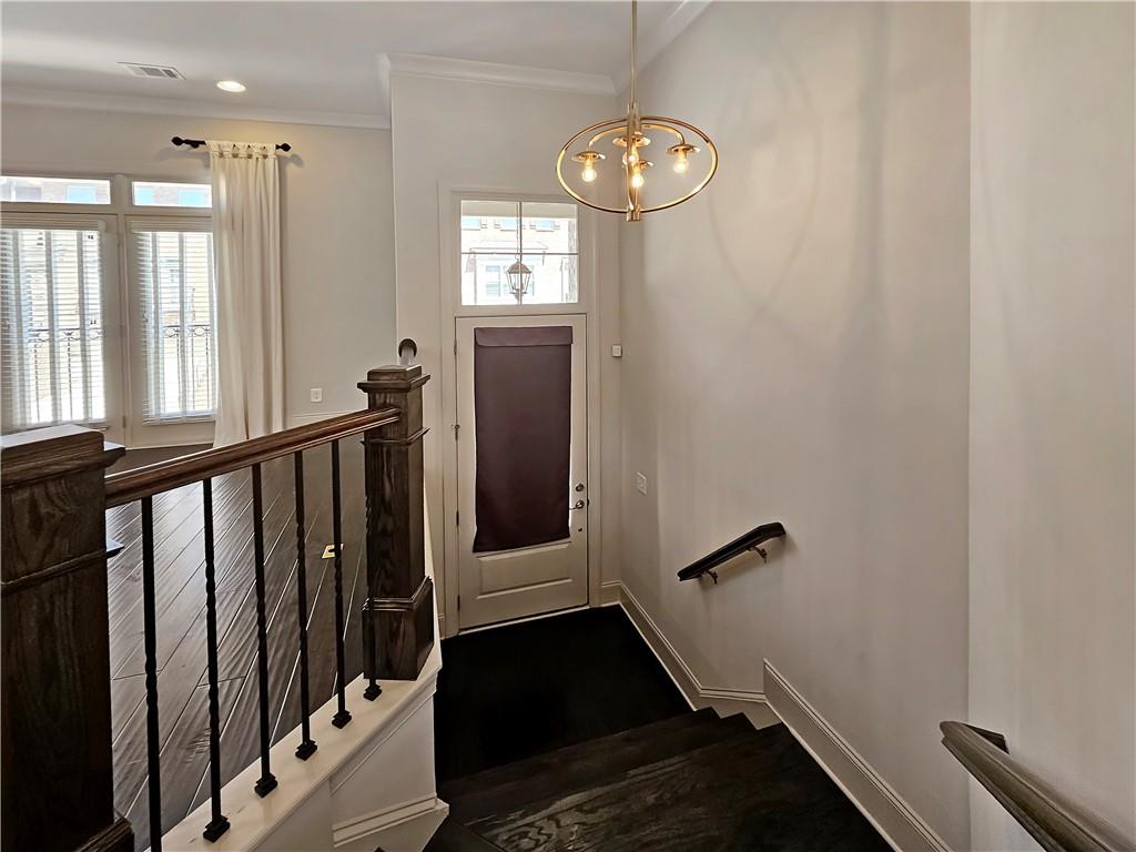 2142 Coventry Drive Brookhaven, GA 30319 - Photo 5 of 52 a view of a hallway with wooden floor and stairs