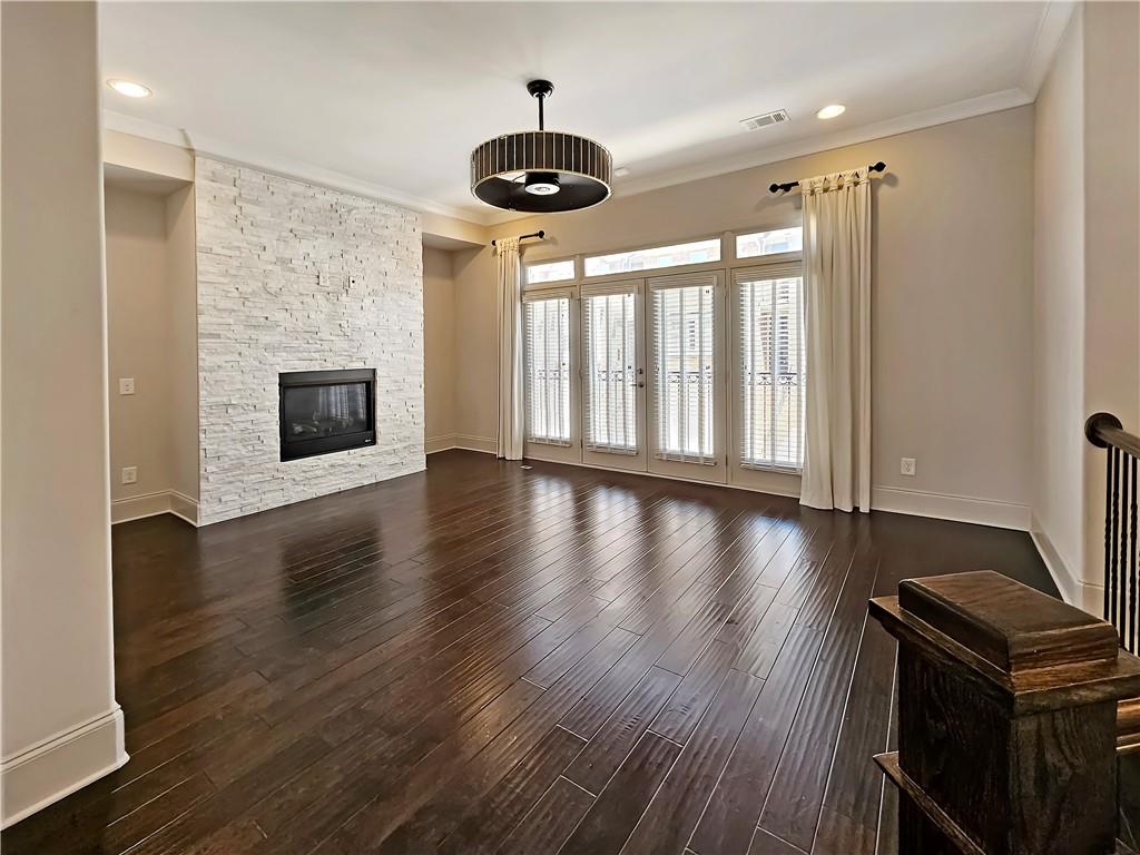 2142 Coventry Drive Brookhaven, GA 30319 - Photo 6 of 52 a view of an empty room with wooden floor and a window