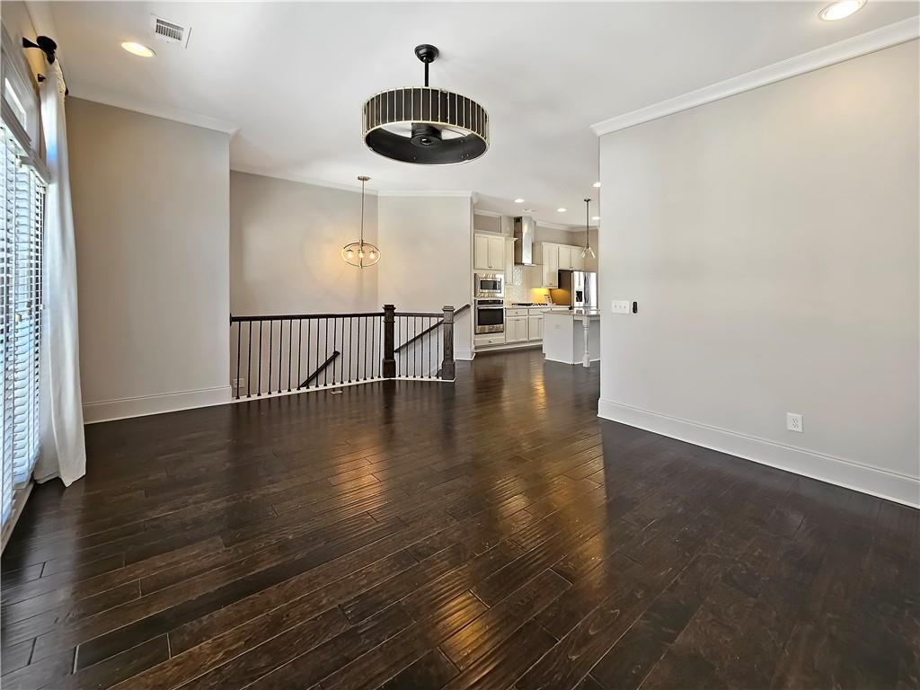 2142 Coventry Drive Brookhaven, GA 30319 - Photo 9 of 52 an empty room with wooden floor and windows